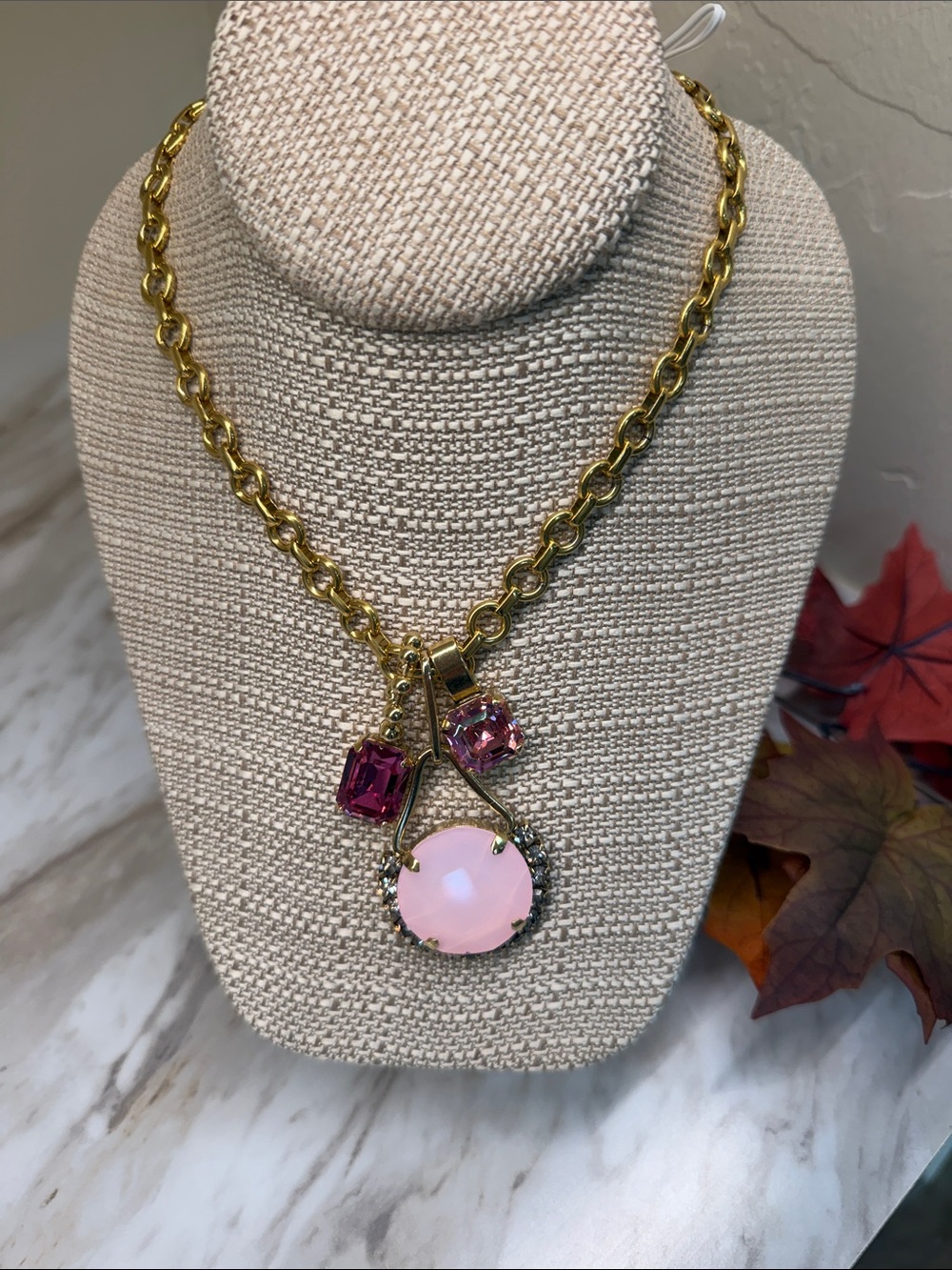 Gold-Tone Necklace with Pink Gemstone Pendant and Accent Stones
